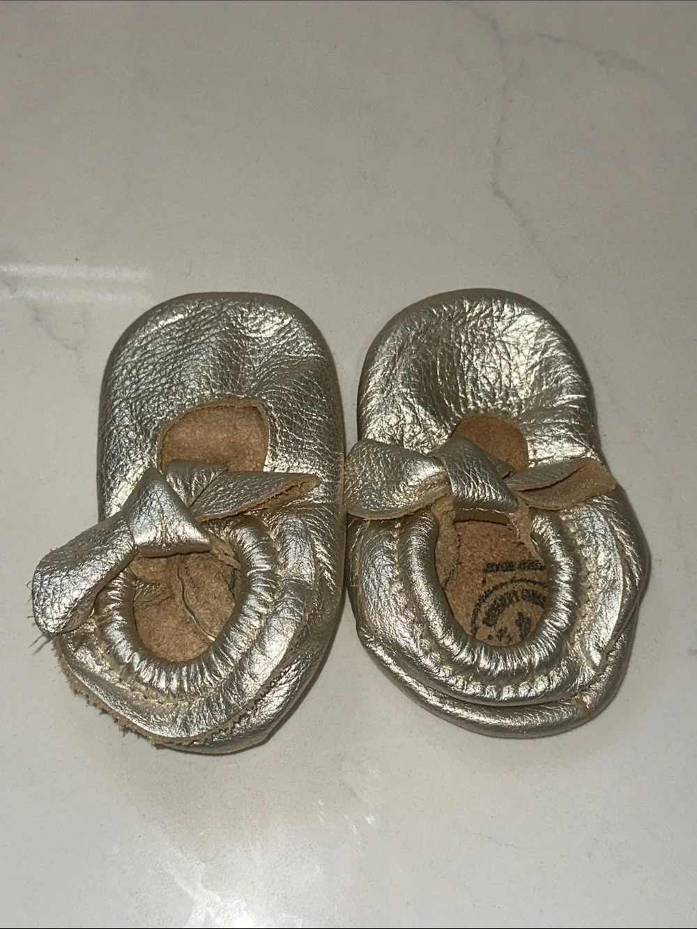 Freshly Picked Metallic Gold Bow Baby Moccasins